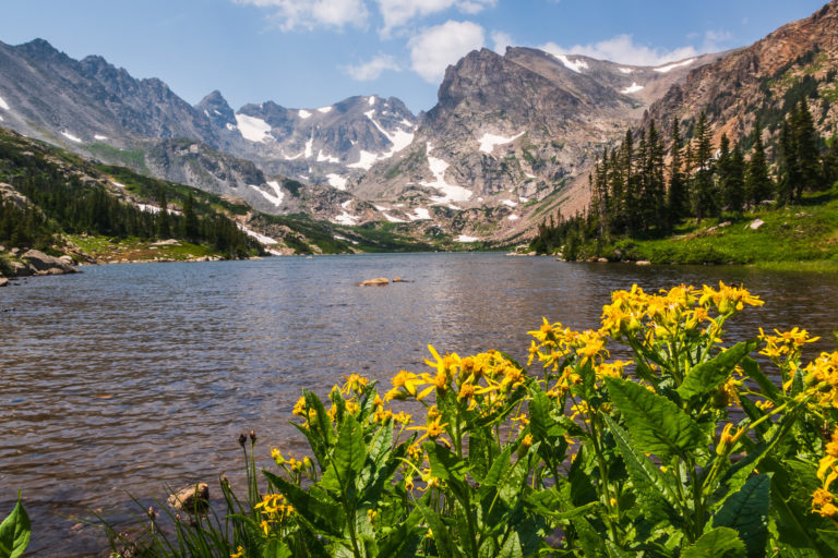 Alpine lake surrounded by mountains in Colorado.